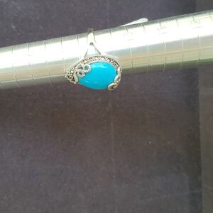 Sterling silver marked Tear Drop Turquoise, surr. by malicite size9 32.00 New